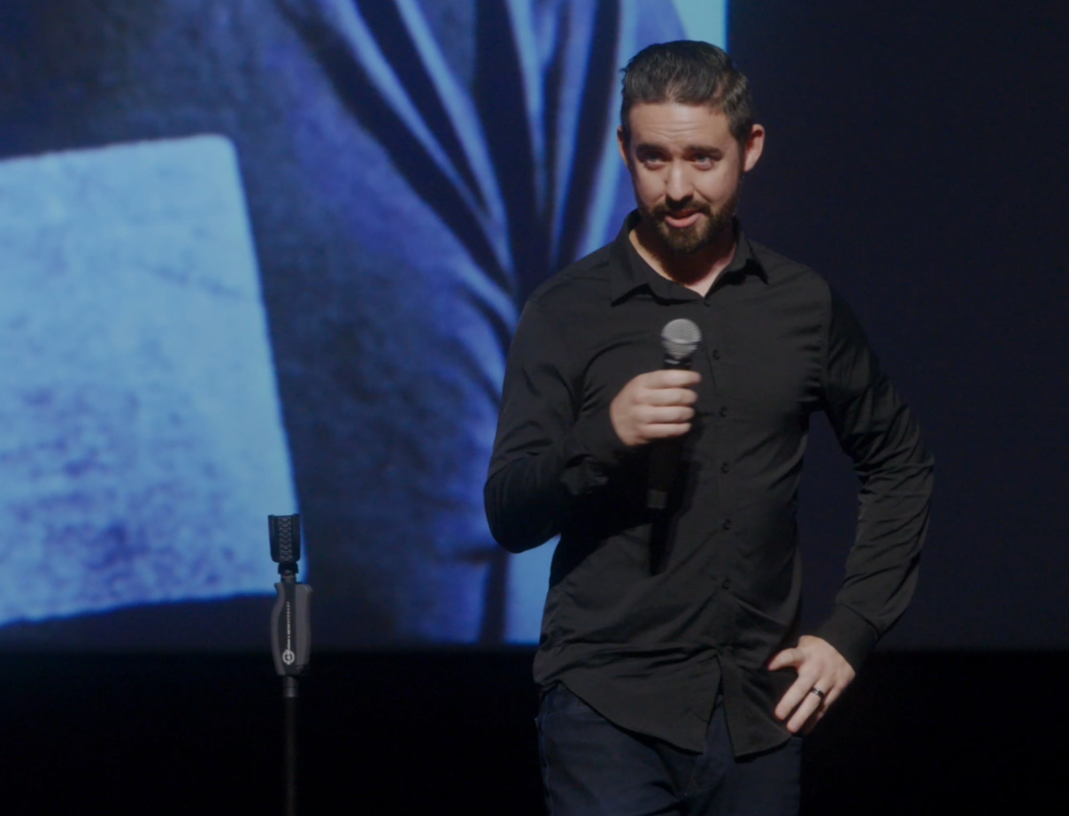 Ryan Baker speaking on stage